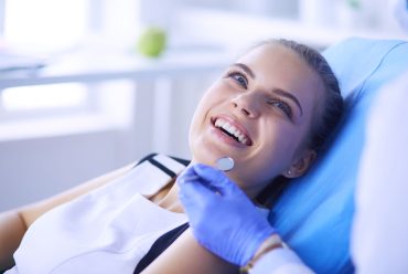a relaxed cheerful woman in a dental chair before dental treatment