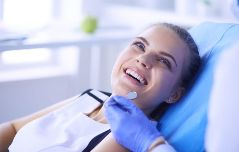 a relaxed cheerful woman in a dental chair before dental treatment