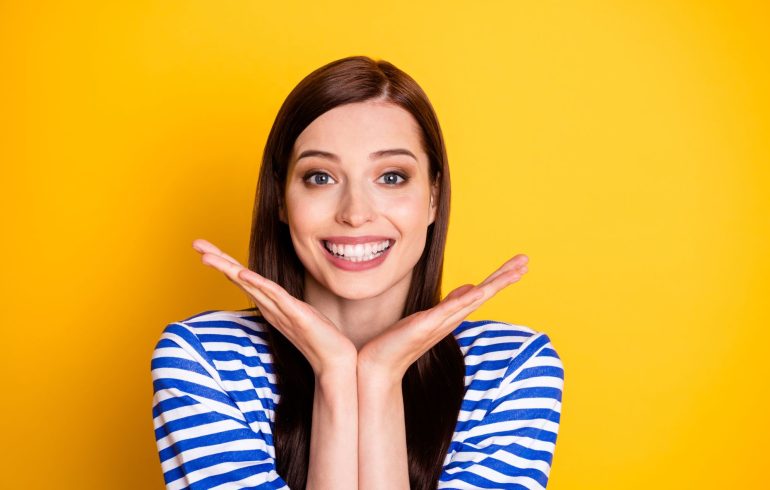 A cheerful young woman with a healthy beautiful smile